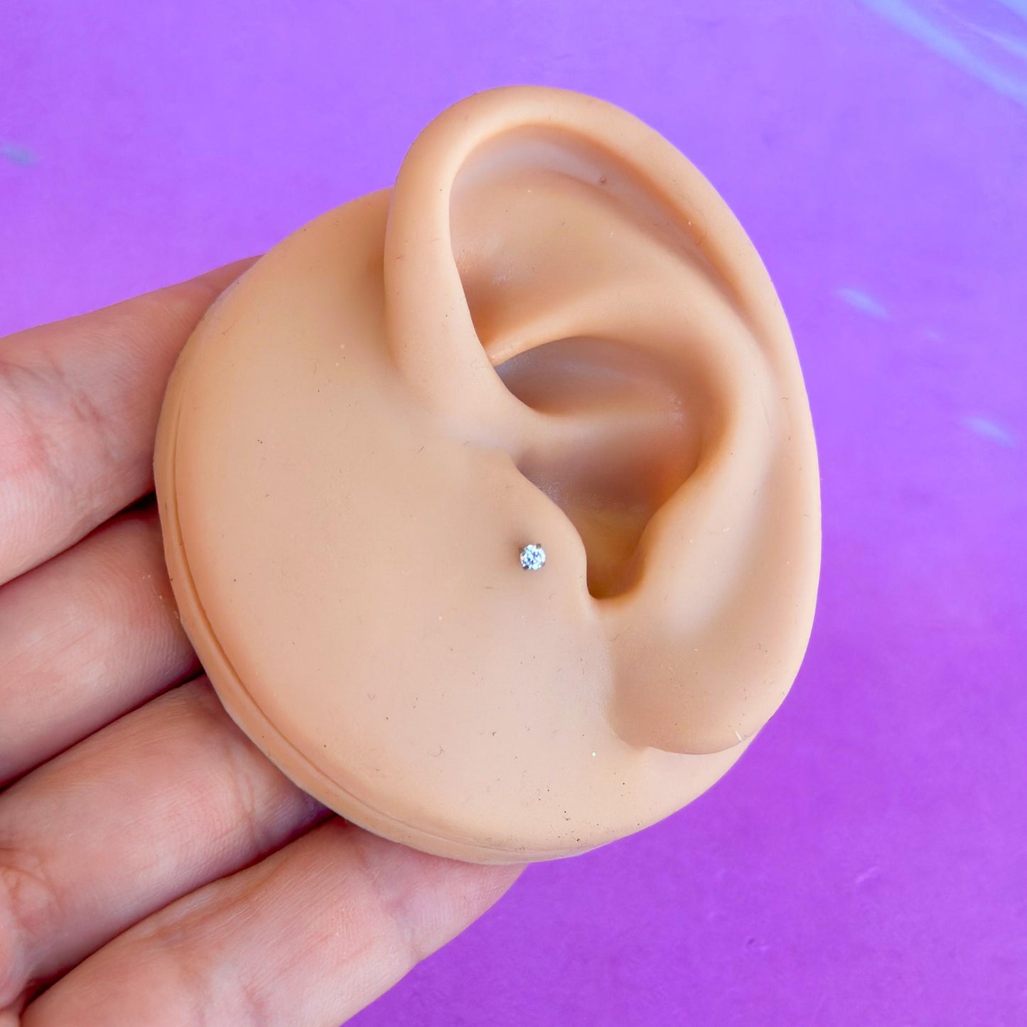 Titanium internally threaded flatback zircon