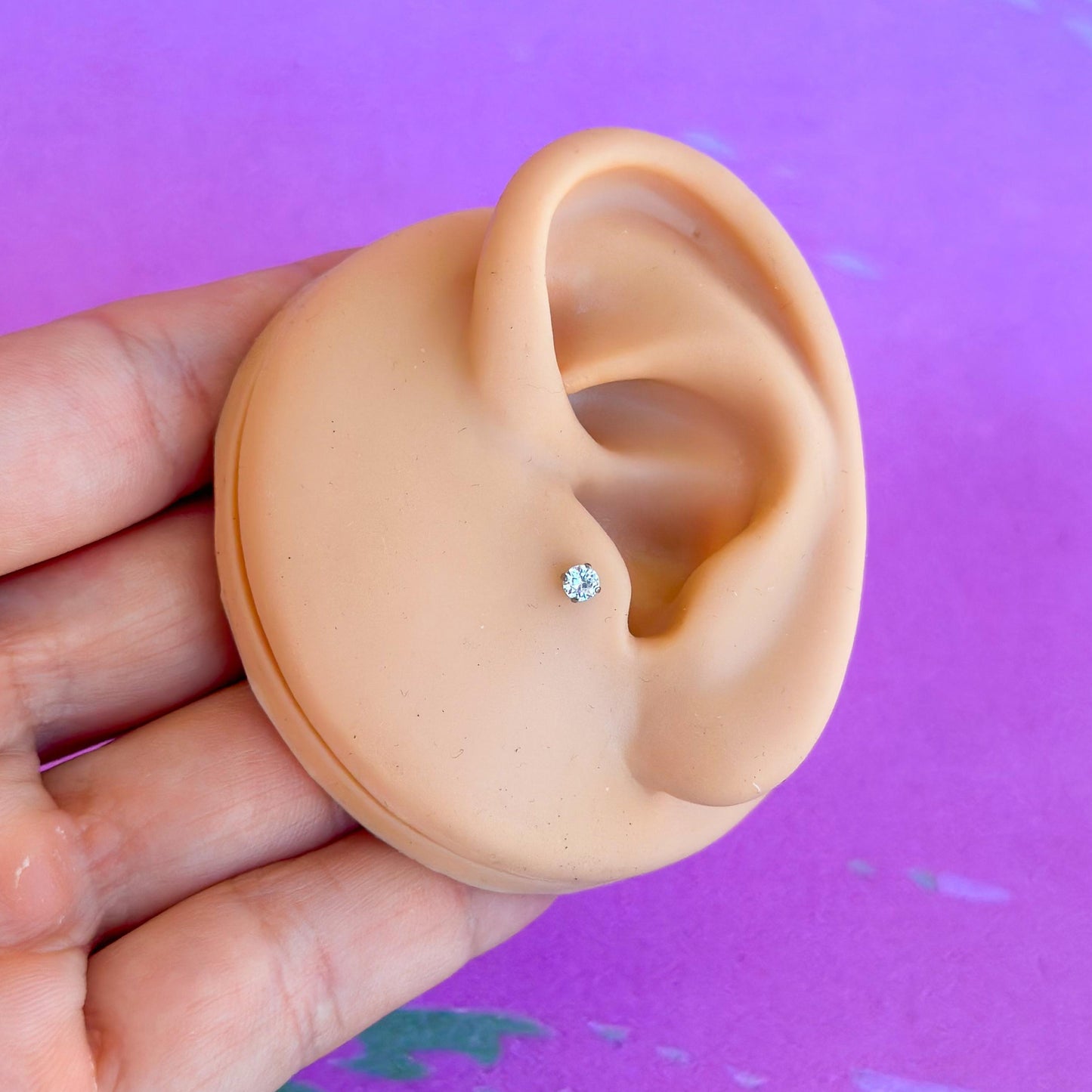 Titanium internally threaded flatback zircon