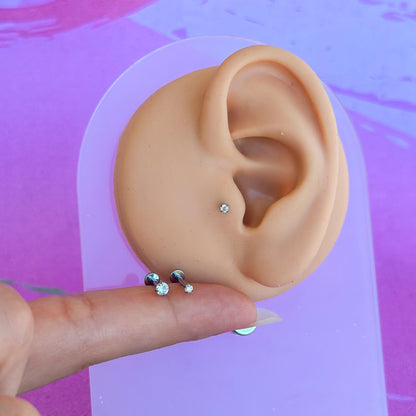 Titanium internally threaded flatback zircon