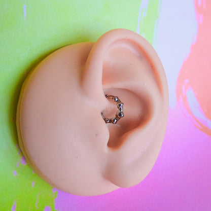 Titanium hearts shape hinged segment