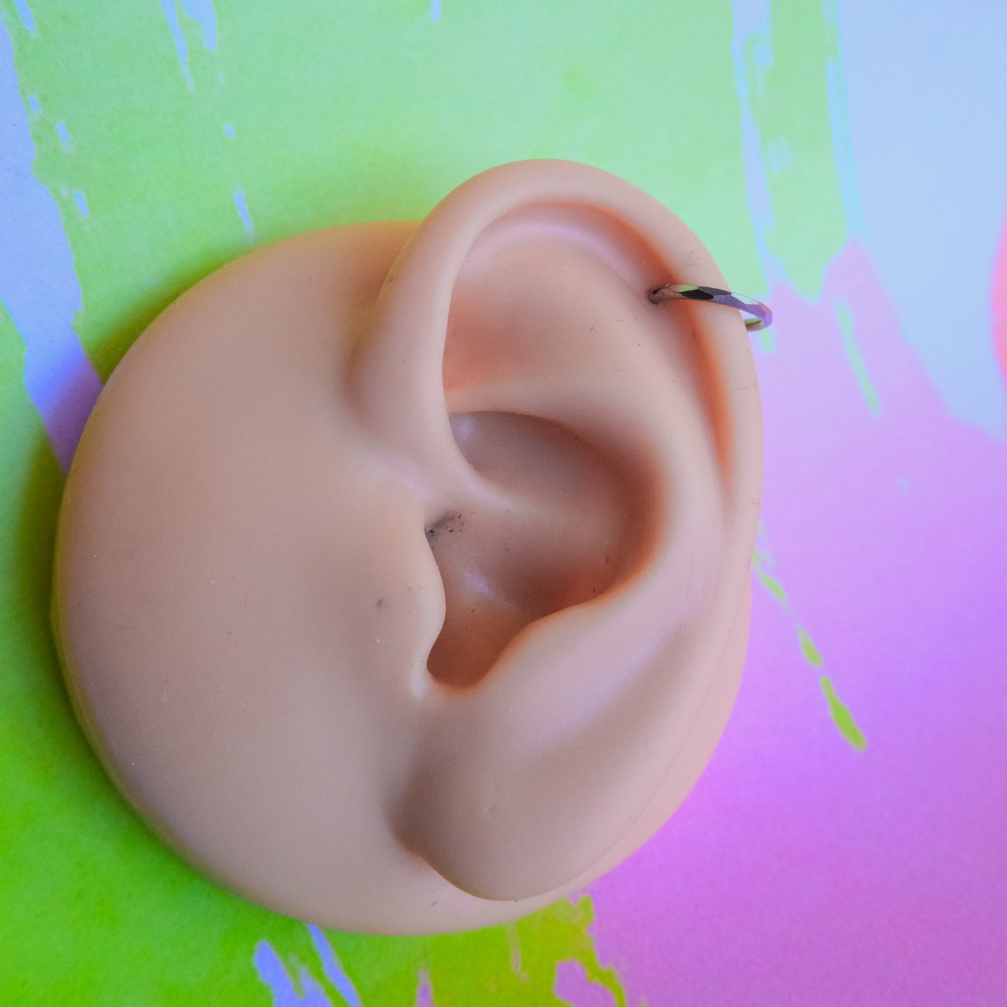 Titanium faceted cut hinged segment