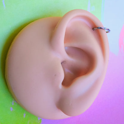 Titanium faceted cut zircon hinged segment