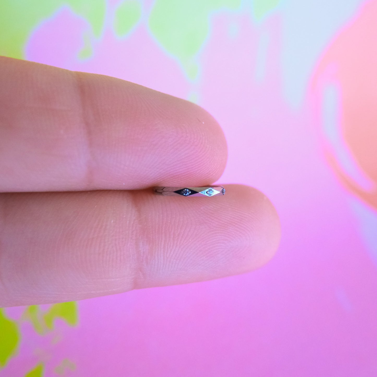 Titanium faceted cut zircon hinged segment